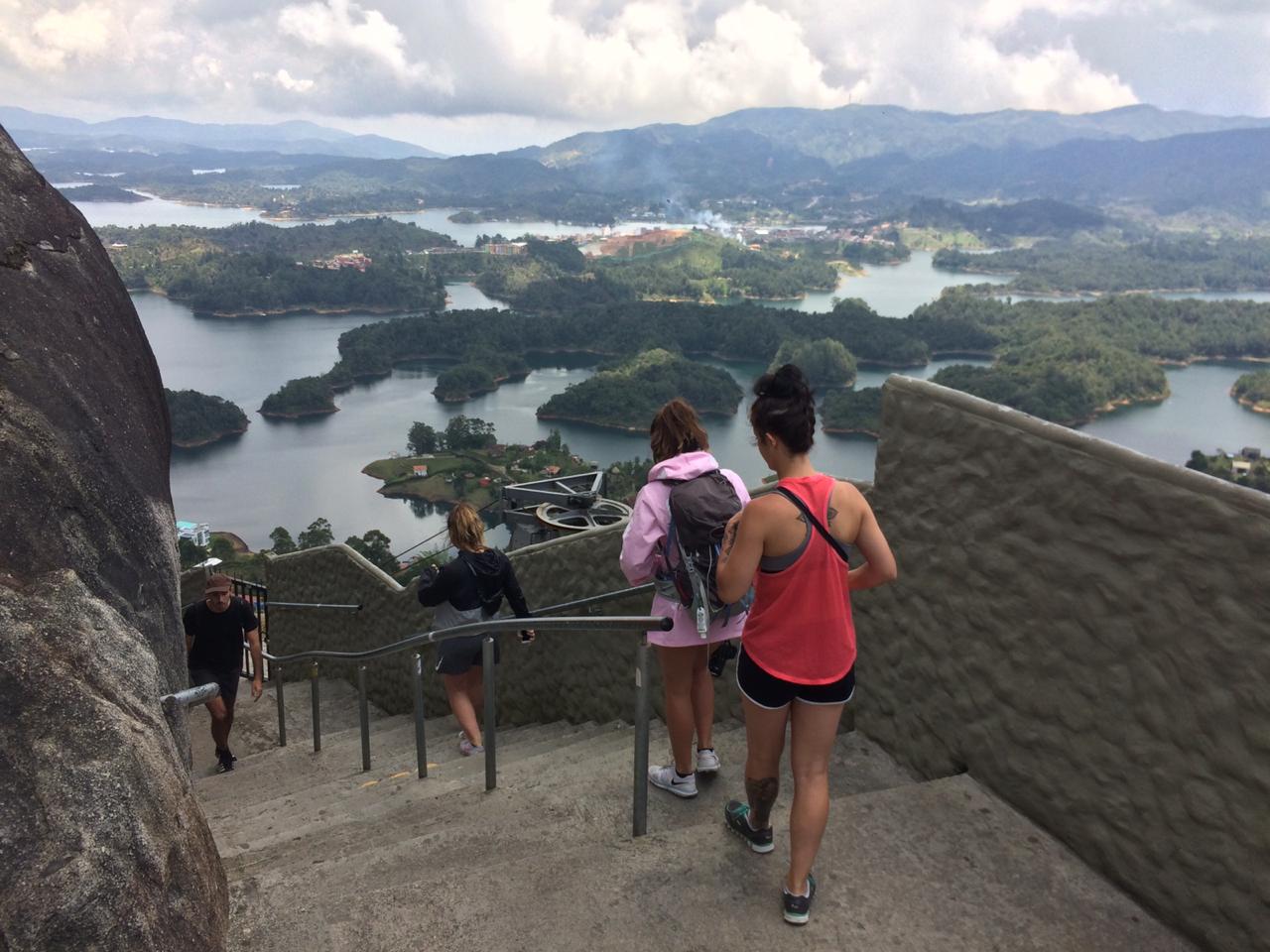 a group in a private Guatape tour at the top of the peñol rock