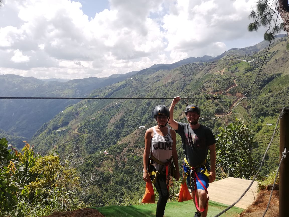 Couple enjoying zip line near Medellín